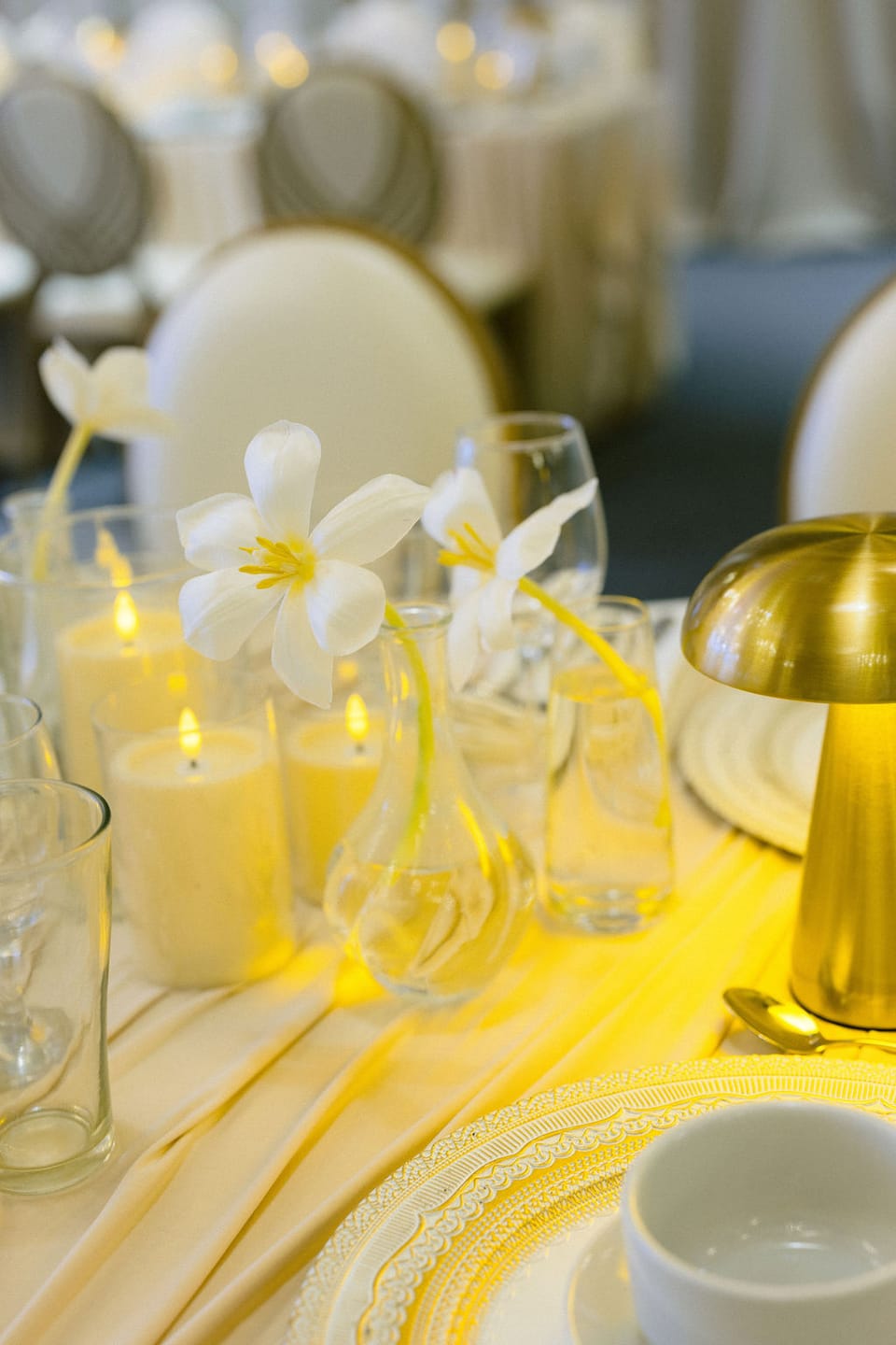 White lily styling with champagne candles